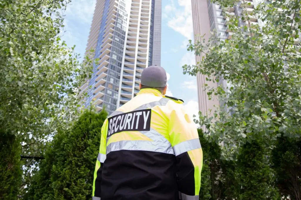 Private Security guard in uniform patrolling a residential area.