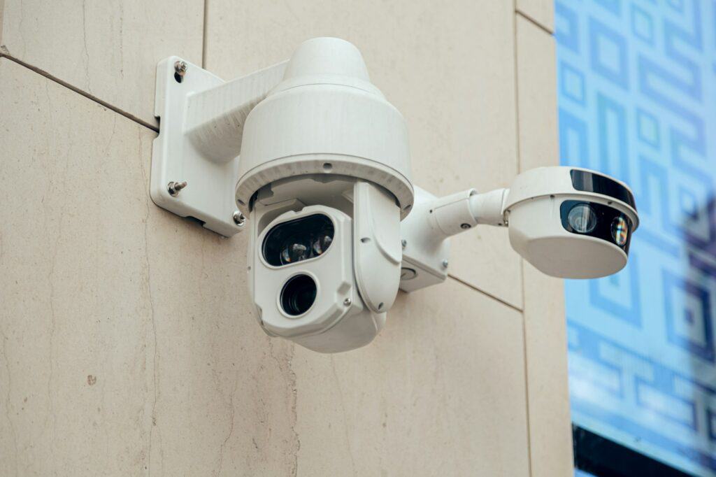 Several Modern CCTV cameras on wall. Concept of enhanced control surveillance and monitoring.